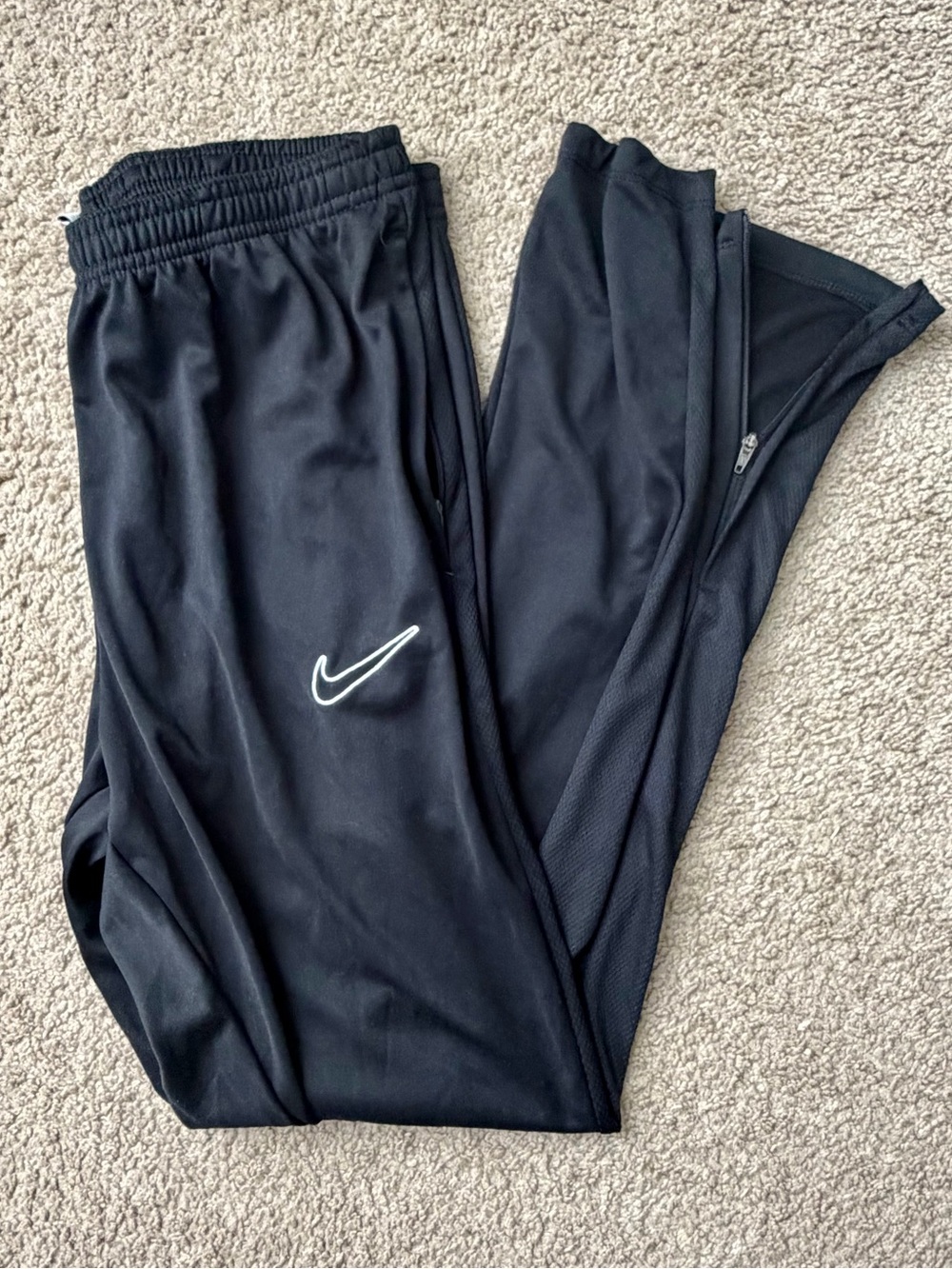 Nike Black Track Pants with White Swoosh and Leg Zips